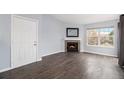 Living room with fireplace and hardwood floors at 5775 W Atlantic Pl # 303, Lakewood, CO 80227