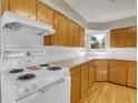 View of kitchen countertops, cabinets, and stove at 6170 W 40Th Ave, Wheat Ridge, CO 80033