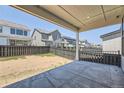 Covered patio overlooking a fenced backyard at 11077 Star Fall St, Littleton, CO 80125