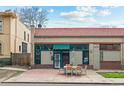 Updated bungalow with patio furniture on a brick patio at 828 29Th St, Denver, CO 80205