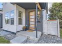 Modern home exterior with a clean design and a welcoming front porch at 2339 S Cherokee St, Denver, CO 80223