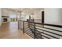 Open-concept living room with fireplace and access to deck at 24113 E 36Th Pl, Aurora, CO 80019