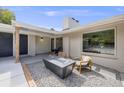 Relaxing front patio features a fire pit and comfortable seating at 14855 Echo Dr, Golden, CO 80401