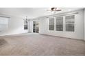 Spacious living area with sliding glass doors and ample natural light at 7844 S Elk St, Aurora, CO 80016