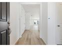 Bright and spacious entryway with light wood flooring at 9723 Ceylon St, Commerce City, CO 80022