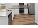 Modern kitchen with stainless steel appliances and granite countertops at 2225 Alyssa St, Fort Lupton, CO 80621