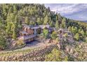 Luxury mountain home with expansive views and solar panels at 3864 Valley Dr, Evergreen, CO 80439