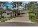 House exterior showcasing a three-car garage and landscaping at 474 Silbrico Way, Castle Rock, CO 80108