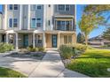 Modern townhome with blue door and landscaping at 888 S Valentia St # 104, Denver, CO 80247