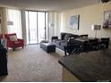 Spacious living room with comfortable seating, dining area, and city views at 1020 15Th St # 26I, Denver, CO 80202