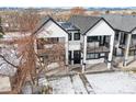Two-story duplex with modern design and snowy landscape at 2321 S Galapago St, Denver, CO 80223