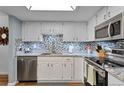 Modern kitchen with stainless steel appliances and granite counters at 13901 E Marina Dr # 105, Aurora, CO 80014