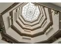 High-ceilinged building interior with an open atrium at 13901 E Marina Dr # 105, Aurora, CO 80014