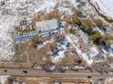 Aerial image showing a house, workshop, and outbuildings on the property at 567 Lake Gulch Rd, Castle Rock, CO 80104
