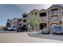 Apartment building with parking and landscaping at 7440 S Blackhawk St # 10-203, Englewood, CO 80112