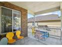 Covered porch with seating area and view of the backyard at 385 N Flat Rock St, Aurora, CO 80018