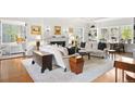 Spacious living room with hardwood floors, fireplace, and built-in shelving at 141 N Gilpin St, Denver, CO 80218