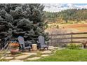 Stone patio with seating and mountain views at 4517 Tallyrand Cir, Castle Rock, CO 80104