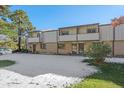 Front view of a townhome with snow-covered yard at 1827 Quail St # 3, Lakewood, CO 80215