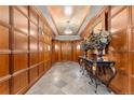 Elegant lobby with wood walls and tile floor at 2001 Lincoln St # 3223, Denver, CO 80202