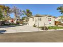 Well-maintained mobile home with a large, paved driveway at 109 Wooster Dr, Firestone, CO 80520