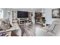 Spacious living room with modern furniture and fireplace at 109 Wooster Dr, Firestone, CO 80520