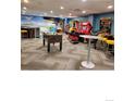 Community game room featuring foosball, arcade games, and seating at 1627 Ski Hill Rd # 2236Eghi, Breckenridge, CO 80424