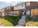 Back view of townhouse with steps and wooden fence at 8051 Wolff St # C, Westminster, CO 80031