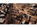 This aerial view captures homes, trees, empty land, and roads in a residential area at 3520 W 80Th Ave, Westminster, CO 80030