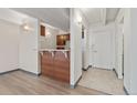 Galley kitchen with wood cabinets and tile flooring at 1265 Race St # 208, Denver, CO 80206