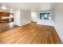 Hardwood floors and an open concept view into kitchen at 123 Emerald St, Broomfield, CO 80020