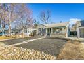 Charming curb appeal with a landscaped yard, updated facade, and front walkway at 2650 S Lafayette St, Denver, CO 80210