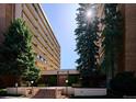 Front entrance of Hampden East Three, with landscaping and steps at 8060 E Girard Ave # 419, Denver, CO 80231
