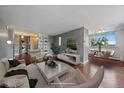 Living room with built-in shelves and hardwood floors at 909 N Lafayette St # 304, Denver, CO 80218