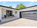 Modern front entry with black door at 2501 S Oakland St, Aurora, CO 80014