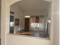 Bright living room with hardwood floors, a fireplace, and large windows at 9804 Grove St # A, Westminster, CO 80031
