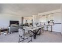 Bright dining area with marble table and seating for four, adjacent to living area at 1155 N Ash St # 1504, Denver, CO 80220