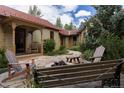 Charming stone patio with fire pit and comfortable seating at 106 S Harris St, Breckenridge, CO 80424