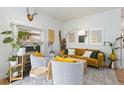 Living room with fireplace and comfy seating at 1217 E 26Th Ave, Denver, CO 80205