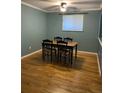 Dining room with hardwood floors and a table with four chairs at 542 E Caley Dr, Centennial, CO 80121