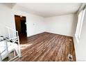 Bright living room featuring hardwood floors and ample natural light at 2888 S Olathe Way, Aurora, CO 80013