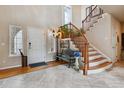 Bright and spacious entryway with staircase at 2891 Canyon Crest Dr, Highlands Ranch, CO 80126