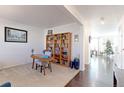 Bright home office with built-in shelving and hardwood floors at 9299 Rifle St, Commerce City, CO 80022