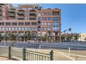 Modern multi-story brick building with large windows and city views at 1499 Blake St # 5I, Denver, CO 80202