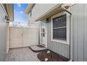 Side entrance with a modern gate and stone patio at 6511 W 96Th Ave, Broomfield, CO 80021