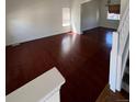 Spacious living room with hardwood floors and large windows at 2217 S Telluride Ct, Aurora, CO 80013