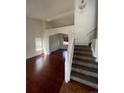 Bright living room with hardwood floors and access to the stairs at 2217 S Telluride Ct, Aurora, CO 80013