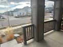 Covered front porch with view of quiet residential street at 4639 Clear Creek Dr, Longmont, CO 80504