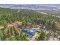 Impressive castle-style home with mountain views and a pool at 5380 N Lariat Dr, Castle Rock, CO 80108