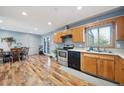 Eat-in kitchen with stainless steel appliances and wood flooring at 13413 W 21St Ave, Golden, CO 80401